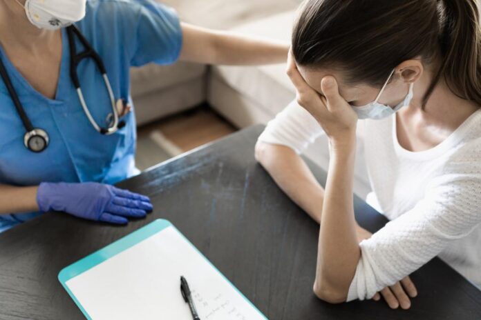 woman crying doctors office