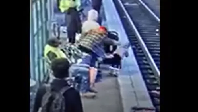 pushing child onto train tracks.webp