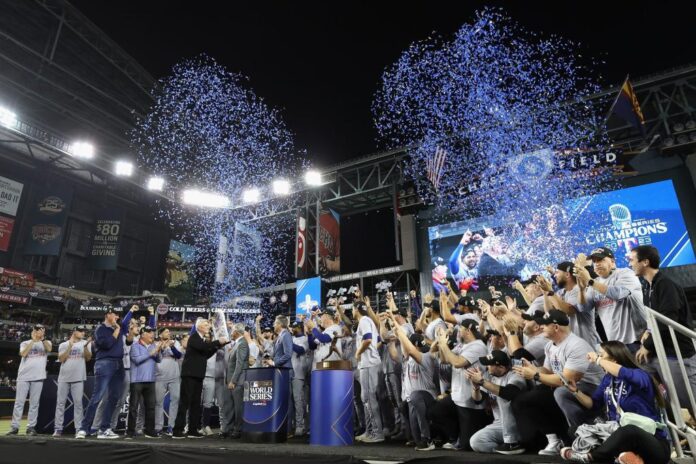 The Texas Rangers are awarded the Commissioners Trophy after defeating the Arizona Diamondbacks in Game Five to win the World Series e1699026181675