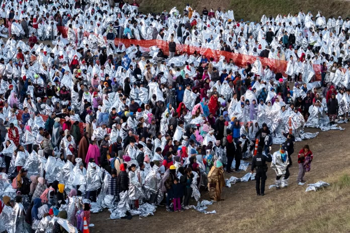 aerial view thousands immigrants wearing 73944356.webp